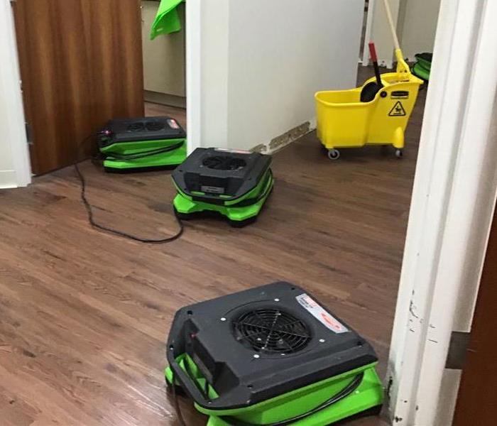 Hallway with green drying equipment.