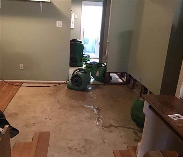 Drying equipment on bedroom floor.