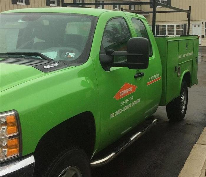 SERVPRO truck parked outside structure. 