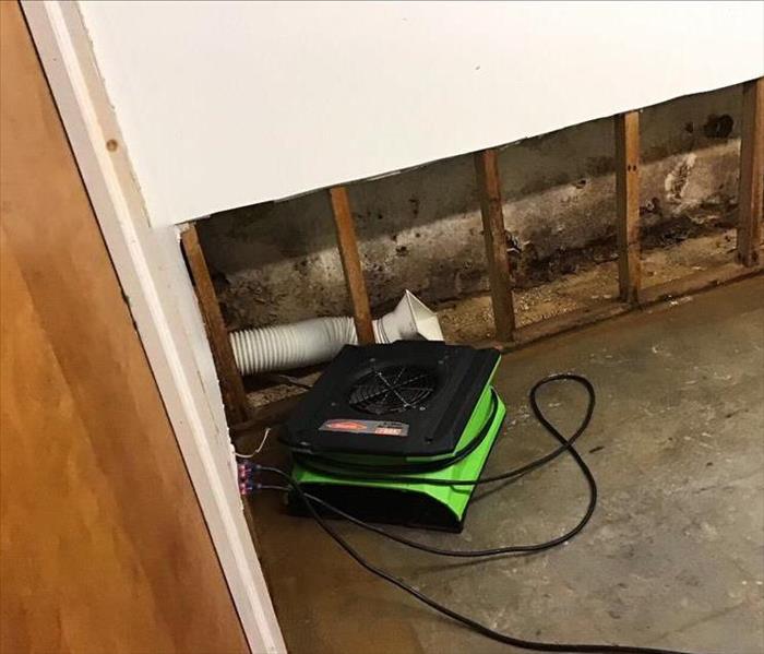 Flood cuts and green drying equipment in a basement.